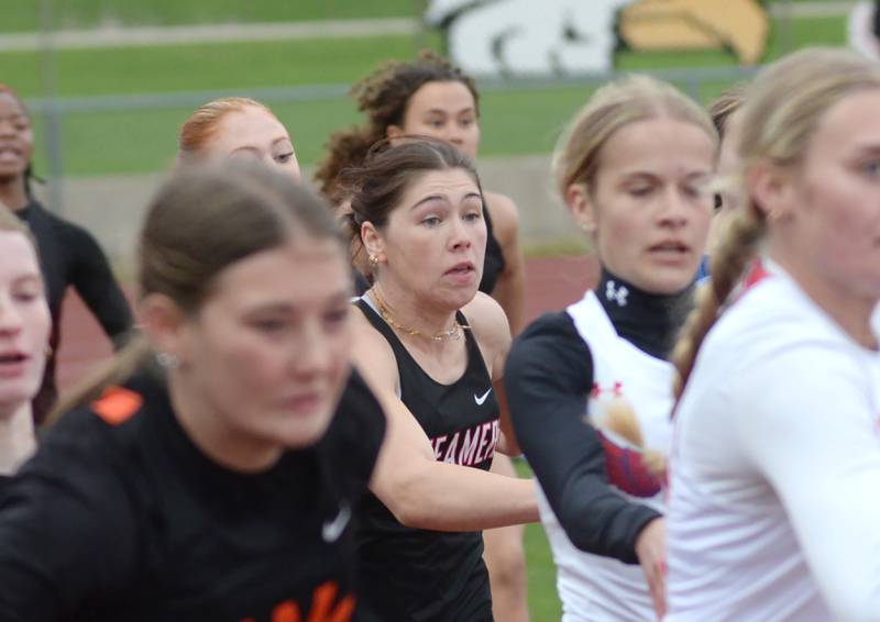 Fulton's Brooklyn Thoms (center) gets the baton from Paige Cramer in the 4x100 relay at the Landers-Loomis Invitational track meet on Friday, April 26, 2025 at Oregon High School. Cramer, Thoms, Haley Smither, and Miraya Pessman finished second in the event in 50.09.