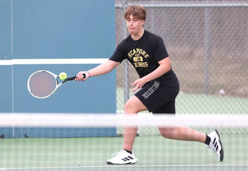 Sycamore’s Jonathan Locascio lunges for a forehand during his number one doubles match along with partner Liam Kerbel against Dixon Thursday, March 30, 2023, at Sycamore High School. This is the inaugural season for the Sycamore boys tennis team.