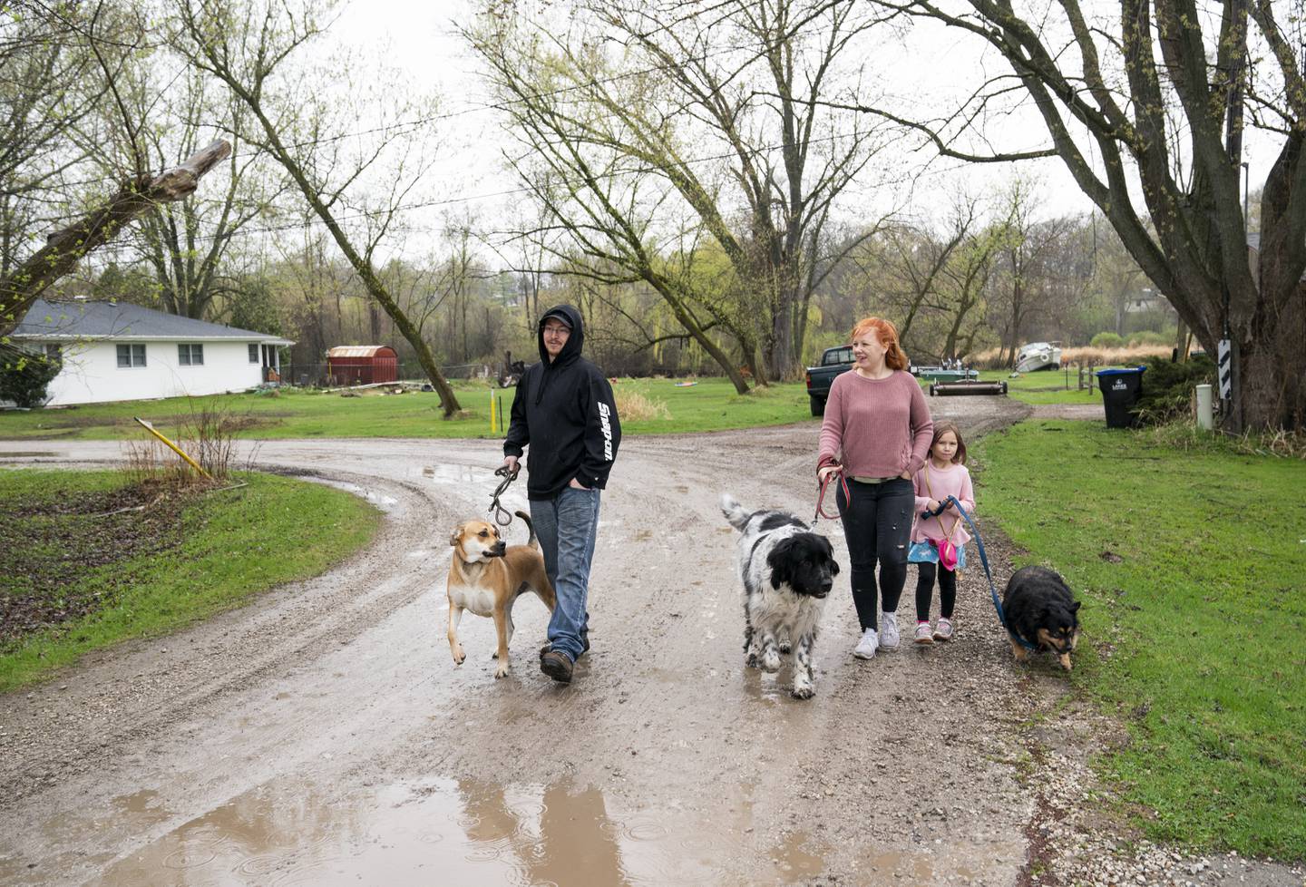 "We know we are going to flood once a year, we just don't know the severity," says Melissa Sanderson as she walks with her husband, Jamie, and daughter, Lilly, 5, near the Nippersink Creek on Saturday, April 10, 2021, in the Dubell Park neighborhood of Spring Grove. The neighborhood is prone to heavy flooding from the creek.