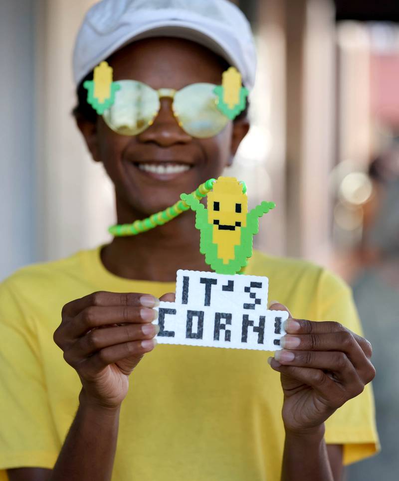 Jordyn Jackson, 16, from Dekalb, shows off some of his corn swag Friday, Aug. 23, 2024, during the DeKalb Corn Fest.