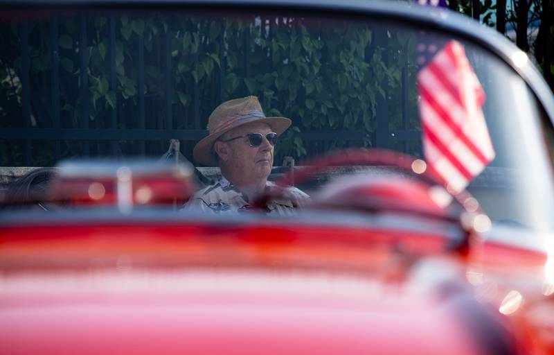 Owner of a 1962 Corvette Bud Yirsa sits in the shade during the Moose Cruise Night at the Moose Lodge  in Downers Grove on Friday, June 3, 2023. Yirsa bought the car used and has owned it for 54 years.