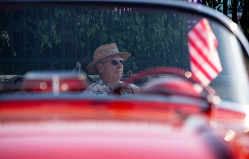 Owner of a 1962 Corvette Bud Yirsa sits in the shade during the Moose Cruise Night at the Moose Lodge  in Downers Grove on Friday, June 3, 2023. Yirsa bought the car used and has owned it for 54 years.