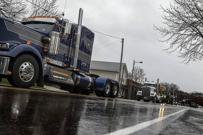 Mourners with vehicles of all kinds proceed Thursday, April 4, 2024 to Riverside Cemetery in Prophetstown in memory of Jayden Hanson.