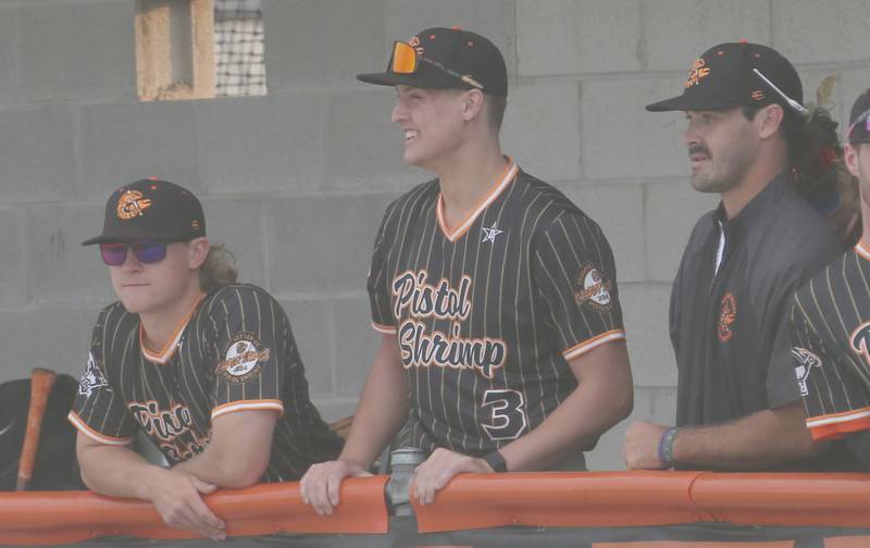 Illinois Valley Pistol Shrimp's Danny Cihocki, of Princeton, (middle) smiles while watching the team play the Alton River Dragons on Thursday, June 5, 2025 at Schweickert Stadium in Peru.