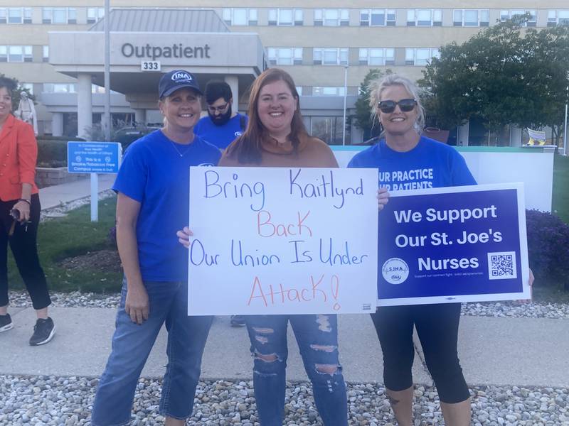 Kaitlynd French (center) stands with fellow St. Joseph nurses Mary Sue Bulger and Beth Corsetti on Oct. 8.