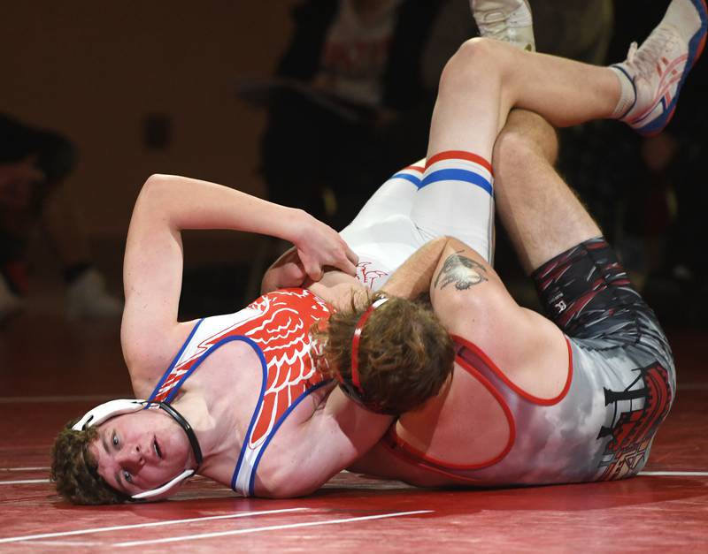 Oregon's Tyler Hendrickson tries to escape from Fulton's Mason Kuebel at 175 pounds during a triangular meet with Polo at Oregon High School on Thursday, Dec. 4, 2025.