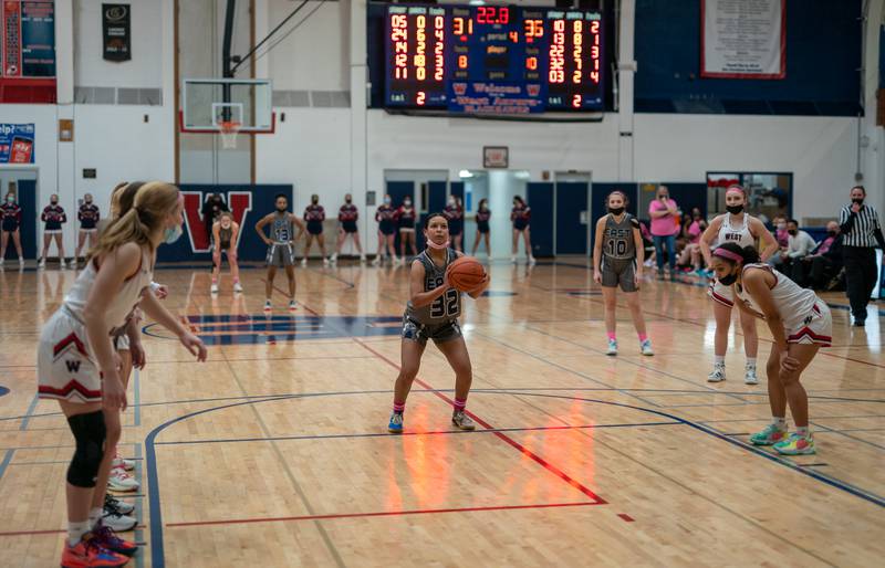 Oswego East's Cami Phillips (32) shoots a free-throw late in the 4th quarter of play against West Aurora during a basketball game at West Aurora High School on Wednesday, Jan 26, 2022.