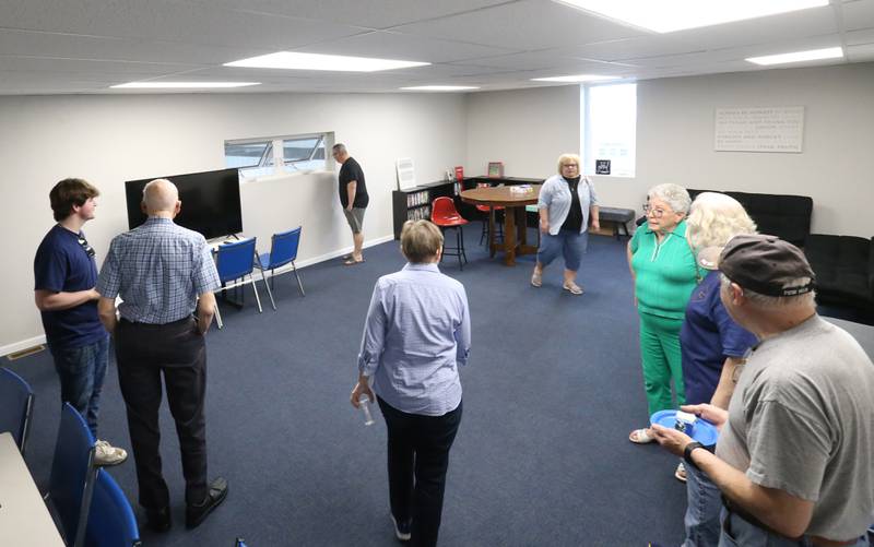 People tour the high school room during a open house on Thursday, April 24, 2025 at the Second Story Teen Center in Princeton. Donors were invited to see the new building. The center officially opens next Tuesday.