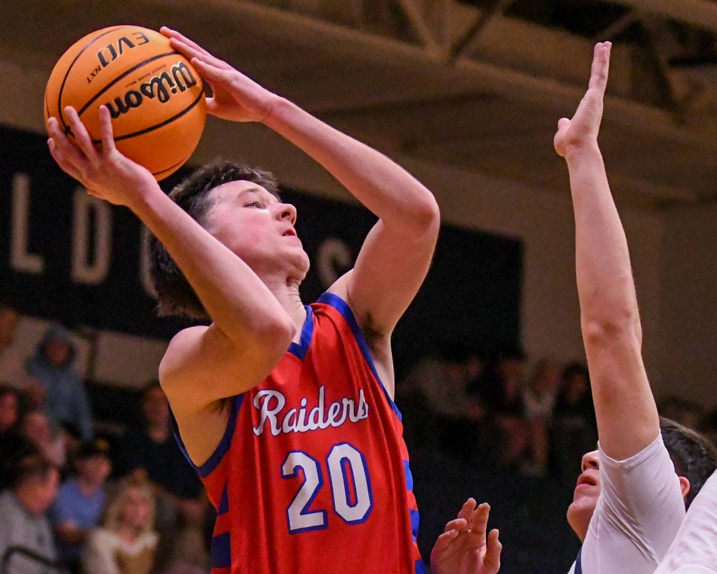 Glenbard South's Will Sieck (20) tries to make a basket while being defended by West Chicago's Oliver Muñoz (24) on Friday, Jan. 3, 2025, at West Chicago High School.
