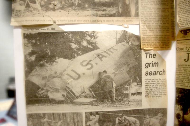 Archival news clippings are displayed as a remembrance was held Saturday at Wonder Lake Fire Protection District Station 2 on the 40th anniversary of a midair military jet explosion that happened over the small, rural area northeast of Woodstock. The plane exploded midair at 9:11 p.m. on March 19, 1982, its flaming pieces raining over a 2-mile area near Greenwood. On board were more than two-dozen members of the Air Force Reserve and Air National Guard. Twenty-seven people died.