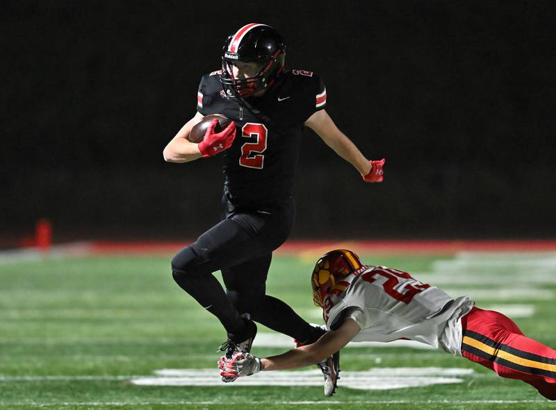 Lincoln-Way Central's Robert Tingley (2) tries elude Batavia's Matthew Hansen (29) during the Class 7A semifinal playoff game on Saturday, Nov 23, 2024 at New Lenox. (Dean Reid for Shaw Local News)