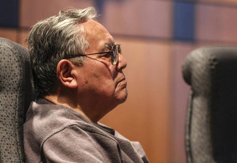 Commissioner George Hernandez listens to Fire Chief Joe Formhals on Monday, April 8, 2019, in Joliet, Ill.