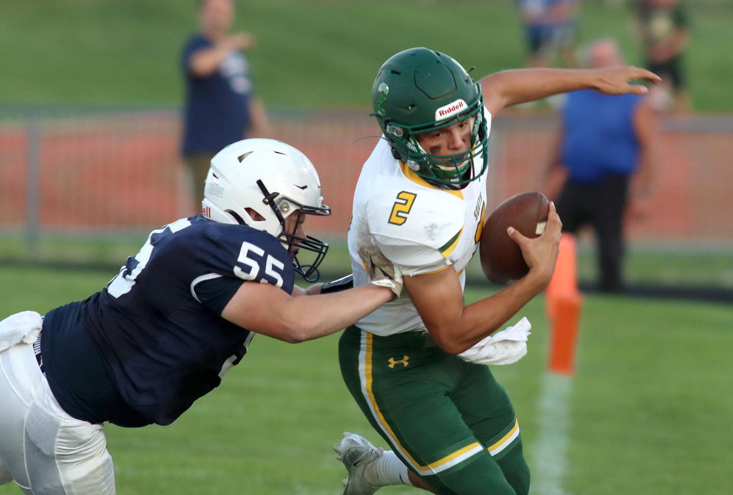 Crystal Lake South’s Caden Casimino is pushed out of bounds by Cary-Grove’s Thomas Burton, left, at Al Bohrer Field on the campus of Cary-Grove High School Friday night.