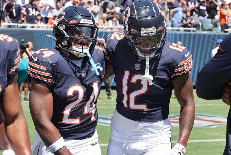 Chicago Bears running back Khalil Herbert (left) is congratulated by wide receiver Velus Jones Jr. after Herbert scored a touchdown during their preseason game against the Tennessee Titans Saturday, Aug. 12, 2023, at Soldier Field in Chicago.
