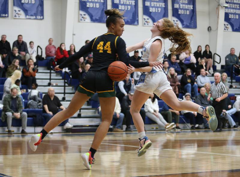 Fremd's Kace Urlacher (44) and Nazareth's Mary Bridget Wilson (15) get tangled up during the girls varsity basketball game between Fremd and Nazareth on Monday, Jan. 9, 2023 in La Grange Park, IL.