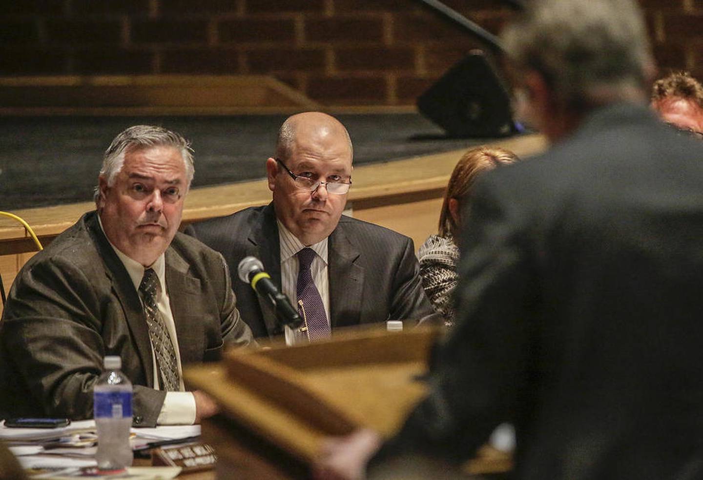 Lincoln-Way Community High School District 210 Board of Education President Kevin Molloy and Superintendent Scott Tingley listen to comment during a recent board meeting at Lincoln-Way Central High School in New Lenox. Molloy has resigned from the school board.
