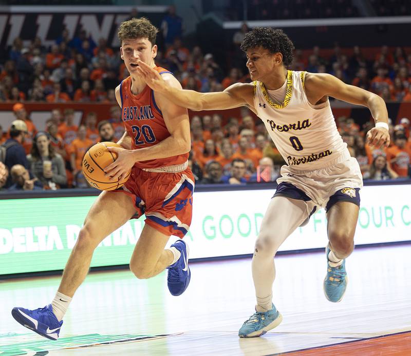 Eastland’s Peyton Spears handles the ball against Peoria Christian’s Trae Brickner Thursday, March 13, 2025, during the Class 1A boys basketball state semifinal.