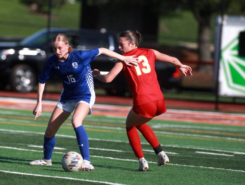 Geneva's Olivia Pohlman and Batavia's Elizabeth Rio battle for the ball during a Tri-Cities Soccer Night game on Tuesday, April 29, 2025 at St. Charles East.