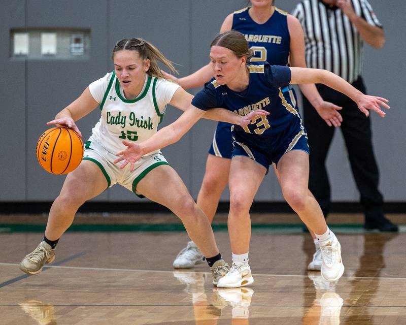 Kylee Rowley (15) of Seneca dribbles ball as Emily Ryan-Adair (13) of Marquette reaches on Monday, November 17, 2025 at Seneca High School in Seneca.