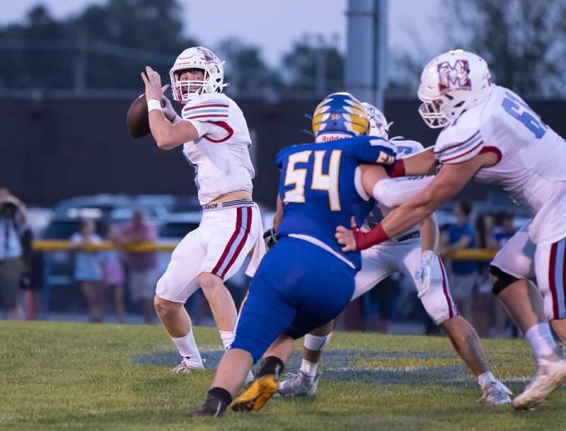 Marian Central quarterback Brendan Hernon looks downfield during the Johnsburg vs. Marian Central football game on Friday, Aug. 27, 2021, at Johnsburg High School.