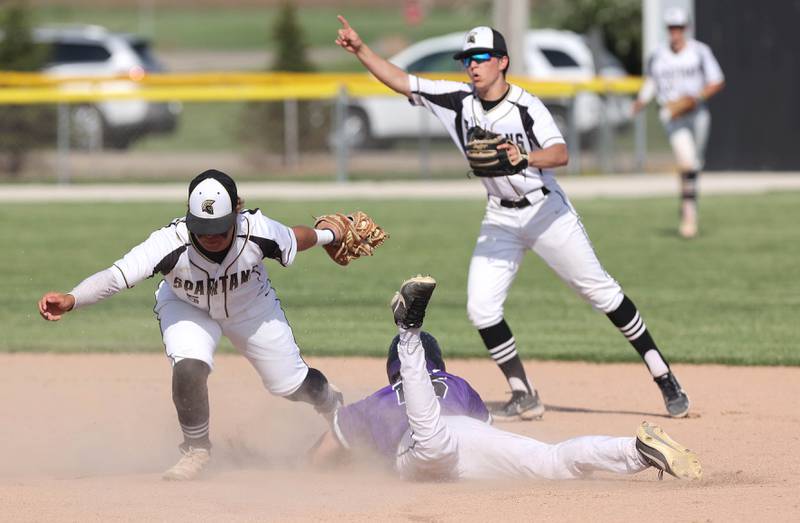 Sycamore's Ethan Steele tags out Dixon's Jacob Gaither on a steal attempt during their game Thursday, May 19, 2022, at the Sycamore Community Sports Complex.