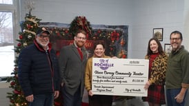 City of Rochelle presents facade grant to Vince Carney Community Theater