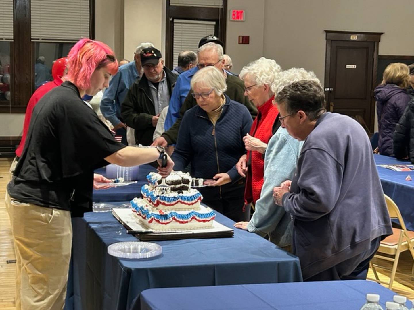 Visitors lined up at the Northwest Territory Historic Center in Dixon on Tuesday night to have a piece of birthday cake to celebrate President Ronald Reagan's birthday and the 40th anniversary of his visit to Dixon in 1984.