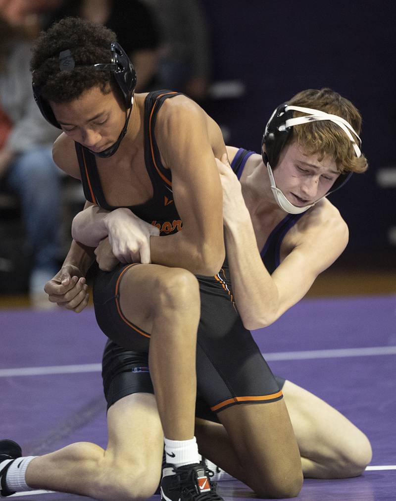 Dixon’s Jack Ragan control Freeport’s Jrue Montoya Tuesday, Jan. 13, 2025, during a triangular meet with Sterling at Dixon High School.