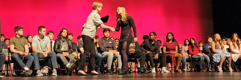 Kishwaukee Symphony Orchestra principal violinist and board member Lynn Slater presenting the KSO High School Senior Musician Scholarship to Jenna Zimmerman