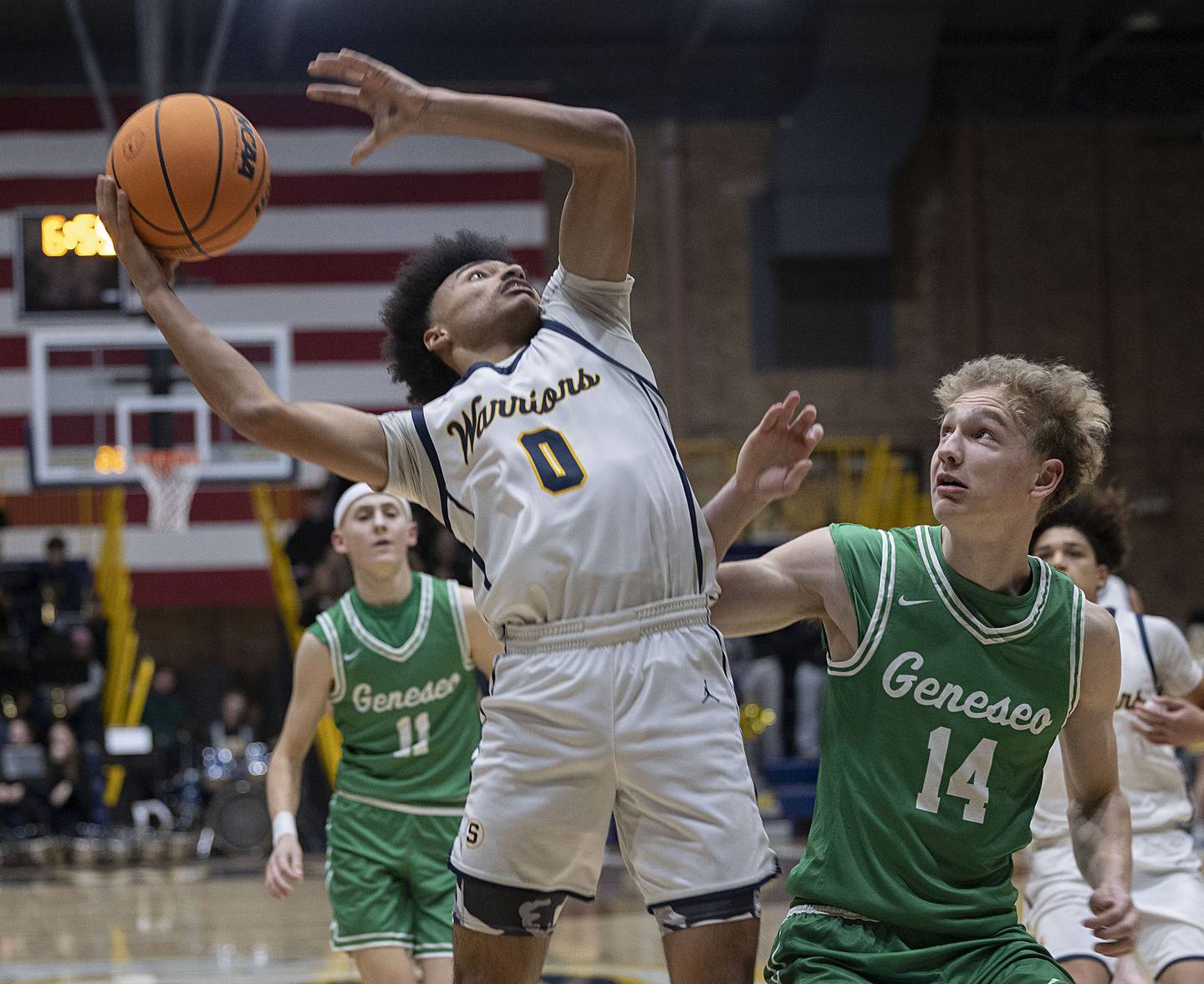 Sterling’s Xavian Prather puts a shot up against Geneseo’s Jack Kreiss Friday, Dec. 5, 2025.