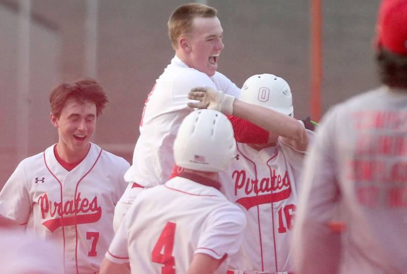 Ottawa's Jaxon Cooper leaps on the back of teammate George Shumway after hitting the game winning run during the Class 3A Regional semifinal game against Streator on Thursday, May 29, 2025 at Pontiac High School.