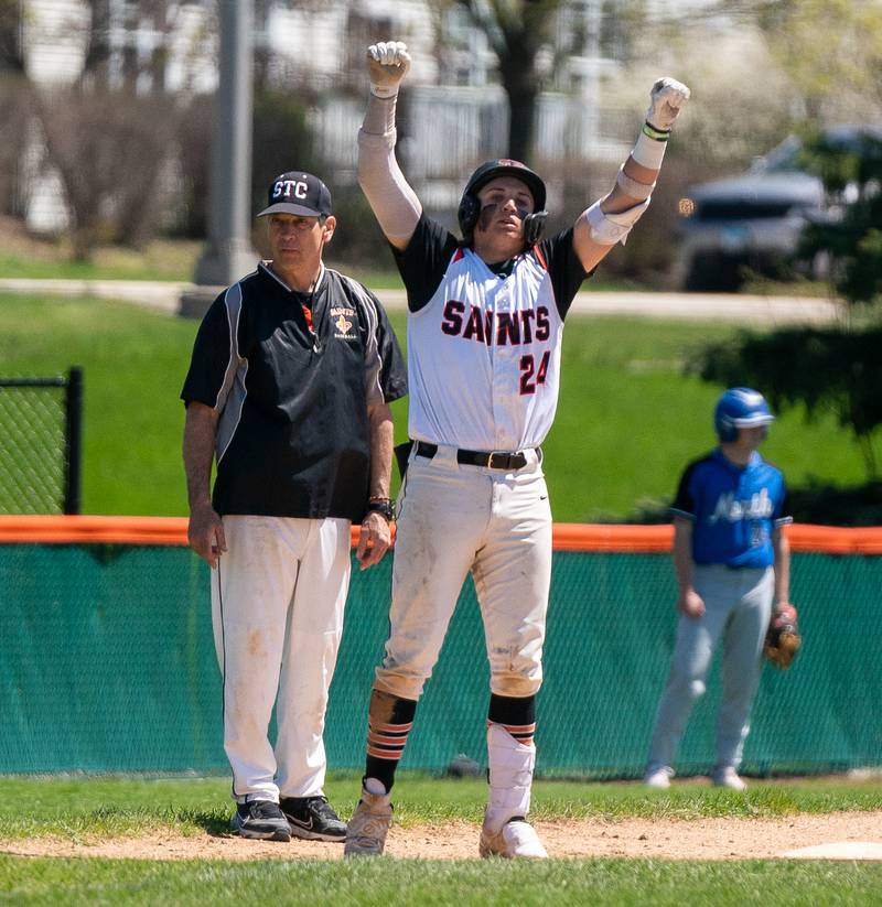 St. Charles East's Jake Zitella (24) reacts after driving in a run against St. Charles North during a baseball game at St. Charles East High School on Saturday, May 7, 2022.
