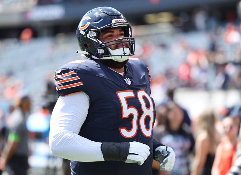 Chicago Bears offensive tackle Darnell Wright looks into the stands as he comes onto the field before their preseason game against the Tennessee Titans Saturday, Aug. 12, 2023, at Soldier Field in Chicago.