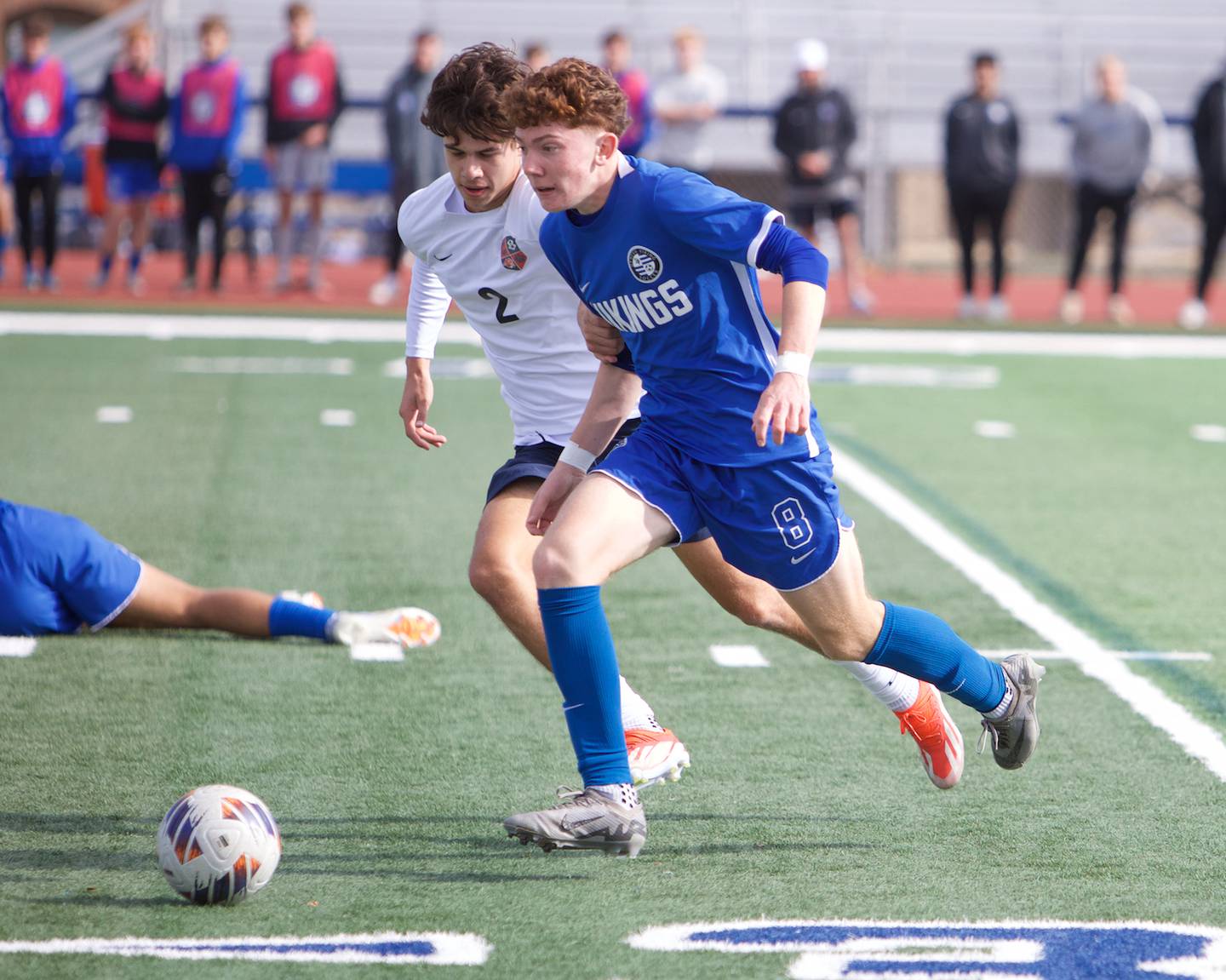 Geneva's Reece Leonard races for the ball with Conant's Chase Staniak at the Class 3A St. Charles North Sectional Final on Saturday, Nov.2,2024 in St. Charles.