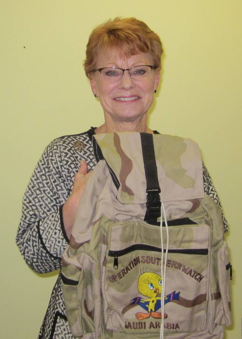 Dory Curnayn, of Winnebago, presented My Experiences in the Military at the November meeting of the Chief Senachwine Chapter NSDAR. Her 20-year career in the U.S. Air Force covered deployment in Japan and the Far East. Curnayn holds a back pack, part of her collection of service-related items of manuals, clothing, web belt, canteen, medical supplies, helmet, size-three combat boots and duffle bag.