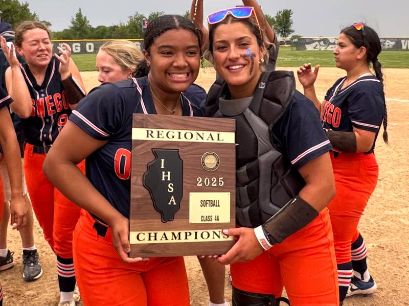Oswego’s Jaelynn Anthony, left, and Kiyah Chavez celebrate their victory over Neuqua Valley winning the Class 4A Oswego East Regional Final Softball Championship at Oswego East High School on Friday, May 30, 2025.