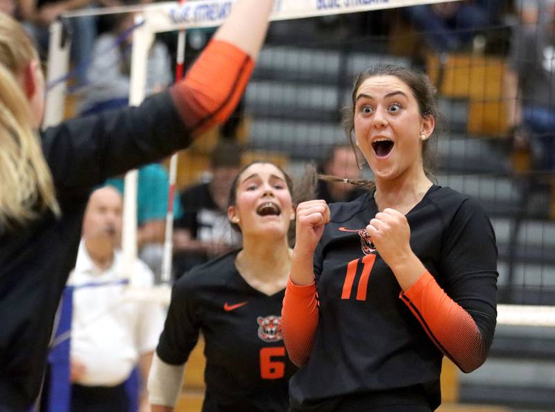 Crystal Lake Central’s Emily Mazza, right, and Clara Dobbertin react as the Tigers close in on a two-set win over Woodstock North in IHSA girls volleyball Class 3A Regional Championship action at Woodstock High School in Woodstock on Thursday, October 30, 2025.