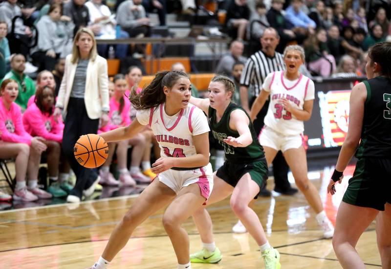 Batavia's Hallie Crane looks to pass the ball during the Class 4A St. Charles East Sectional final against Glenbard West on Thursday, Feb. 27, 2025 in St. Charles.