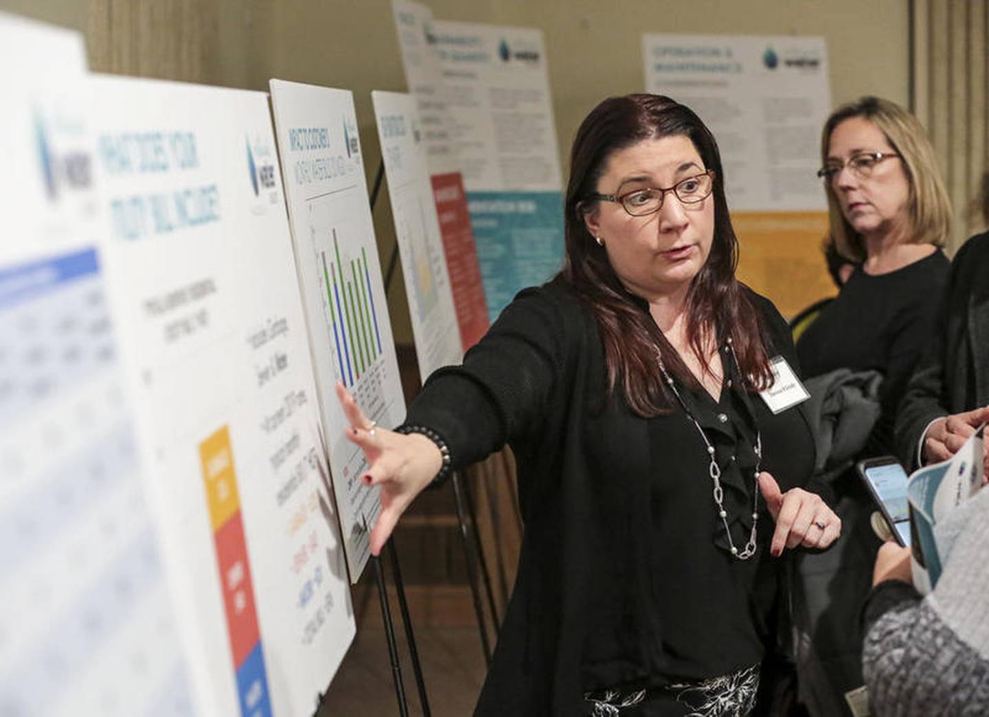 Consultant Theresa O'Grady speaks to several residents on Thursday during a public forum on the future source of Joliet's water at Cantigny Post 367 VFW in Joliet.