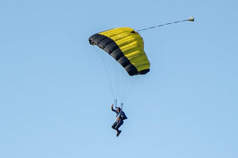 Skydivers from Skydive Chicago soar overhead opening day of youth soccer on Saturday, Aug 16, 2025, at Peck Park in Ottawa.