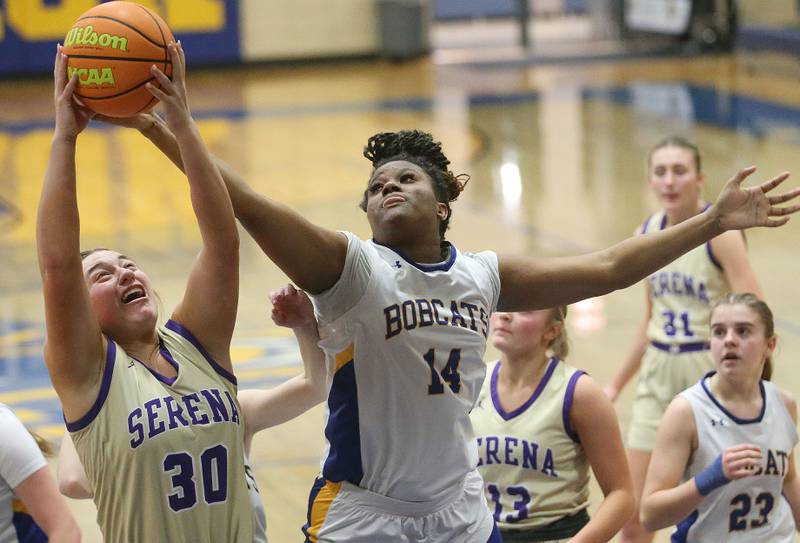 Serena's Maddie Glade grabs a rebound over Somonau/Leland's Leah Norris on Monday, Feb. 10, 2025 at Somonauk High School.