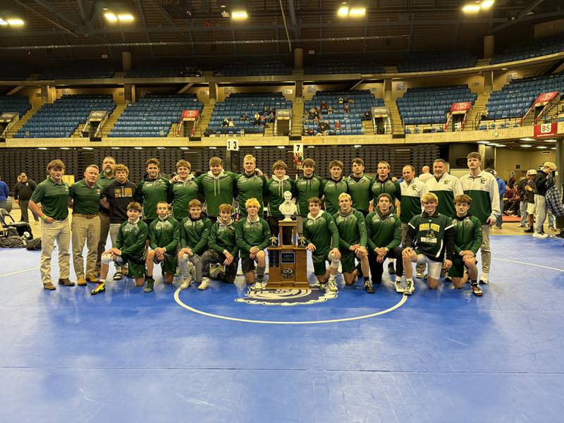 The Coal City boys wrestling team poses with their Abe's Rumble trophy on Dec. 30, 2025.