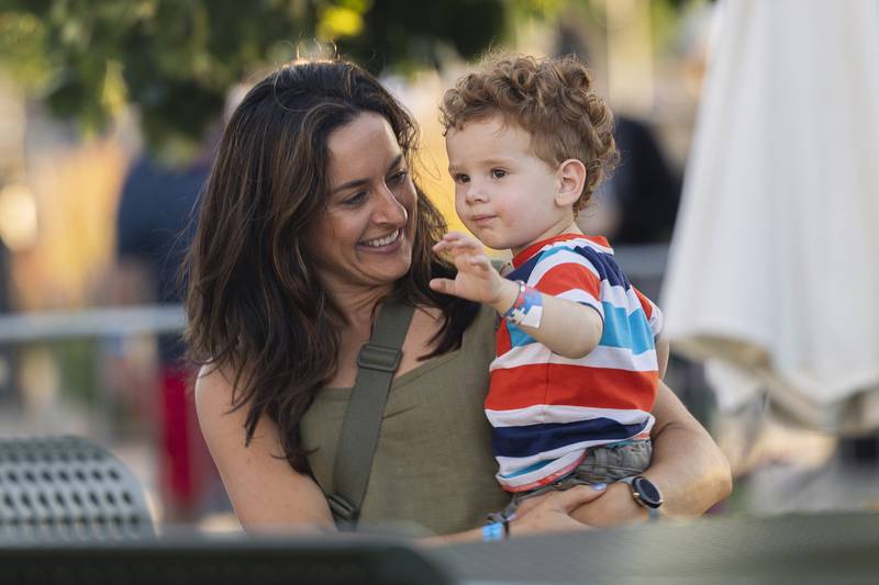 Avett, 2, and Mandy Hinkey dance to music Thursday, July 4, 2024 in Dixon during Petunia Fest. The fun will continue with lots more planned over the next couple days.