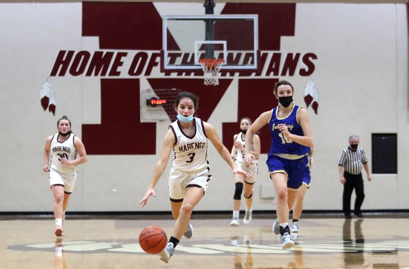 Marengo’s Keatyn Velasquez moves the ball up court against Johnsburg during girls varsity basketball action in Marengo Thursday night.