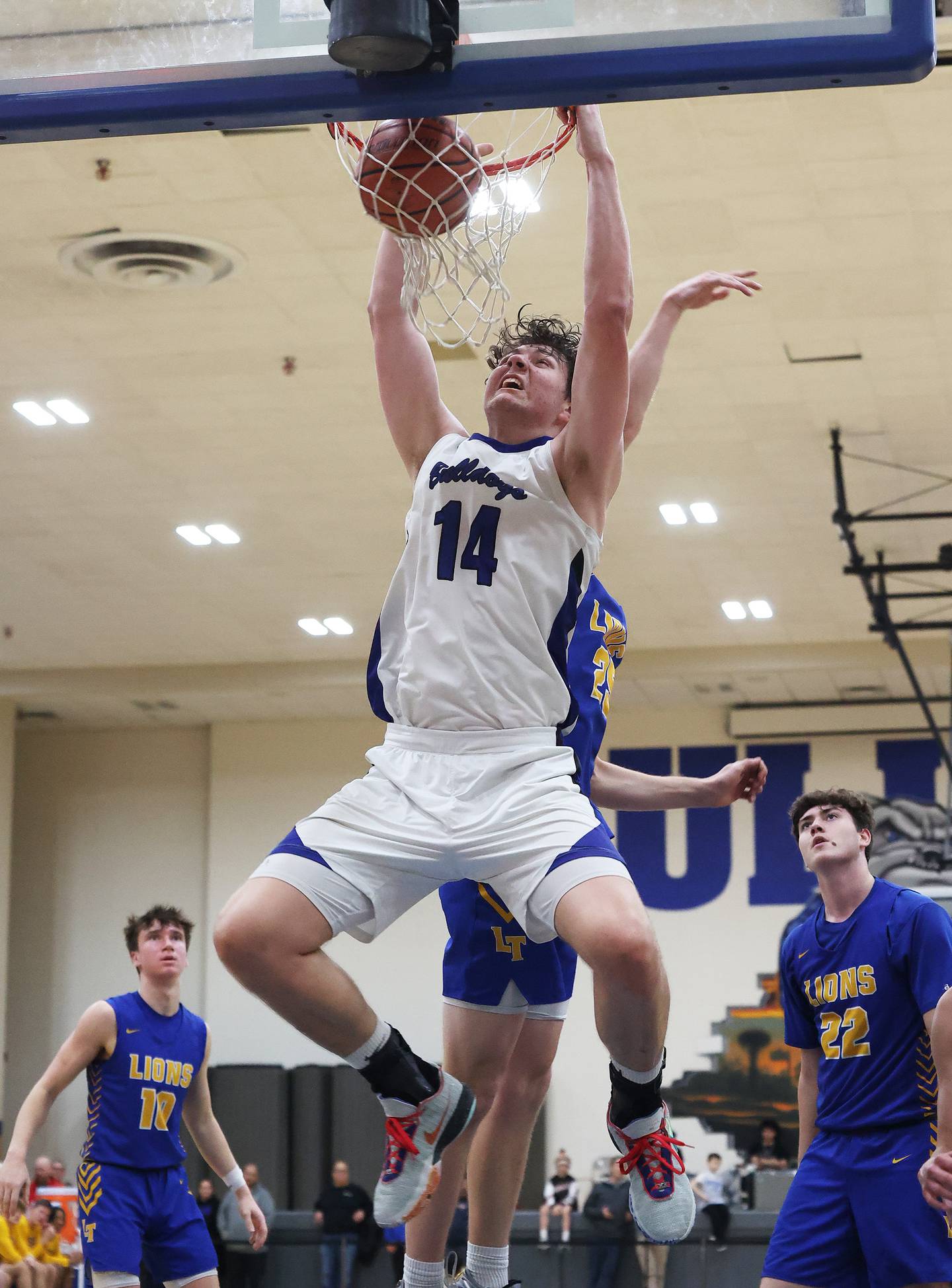 Riverside Brookfield’s Stefan Cicic (14) dunks against Lyons during a boys varsity basketball game on Friday, Jan. 26, 2024 in Riverside, IL.