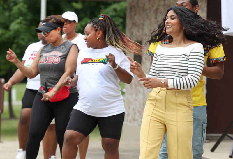 Dancers show off their moves at the bandshell during the Juneteenth Community Celebration Saturday, June 15, 2024, at Hopkins Park in DeKalb.