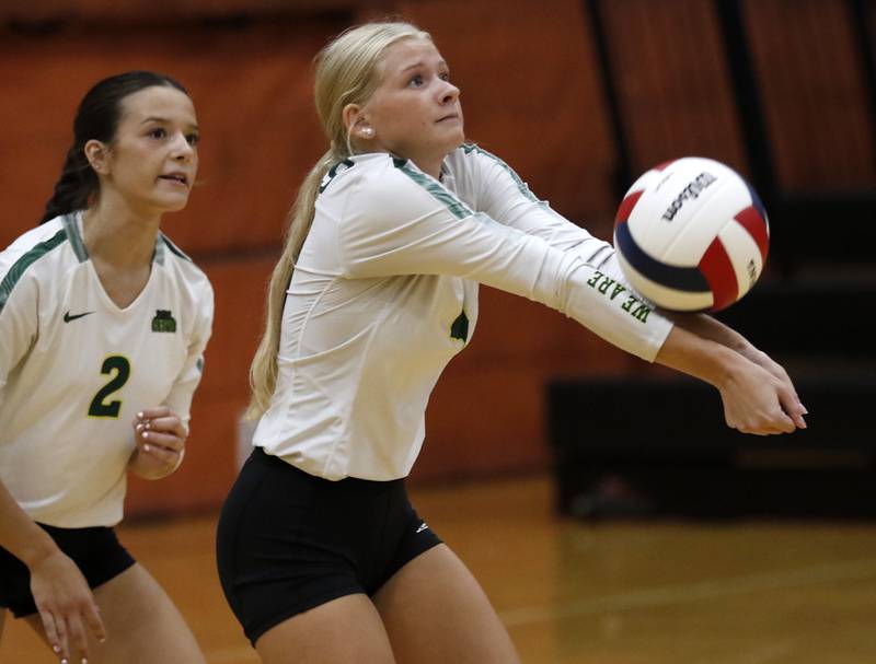 Crystal Lake South's Maddy Cook passes the ball forward in front of her teammates, Crystal Lake South's Olivia Kouretsos during a Fox Valley Conference volleyball match against McHenry on Thursday, Aug. 28, 2025, at the Freshman Campus of McHenry High School in McHenry.