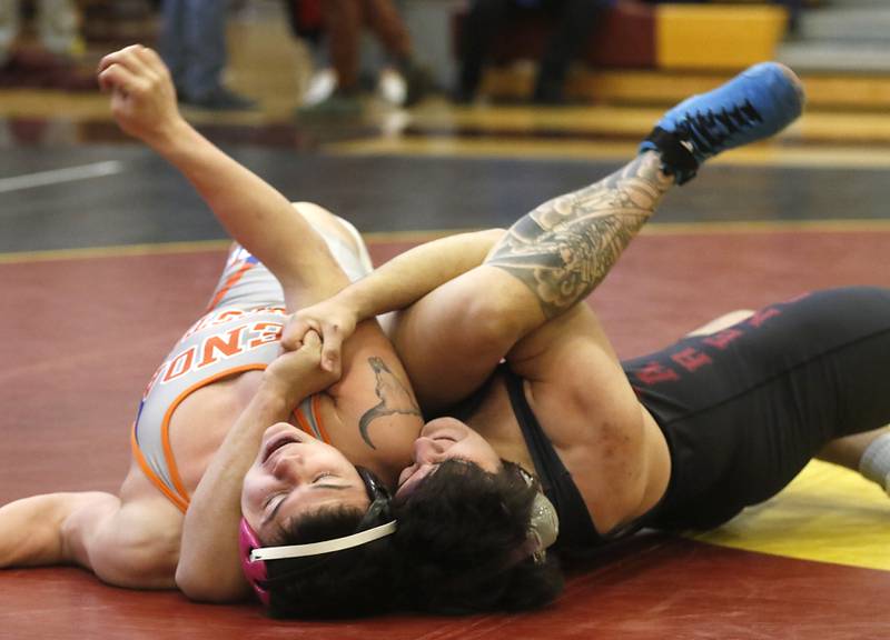 Marengo’s Eddie Solis (right) pins Genoa-Kingston’s Julian Torres their 195-pound championship wrestling match in the IHSA 1A Richmond-Burton Wrestling Regional Thursday, Jan. 19, 2023, at Richmond-Burton High School in Richmond.