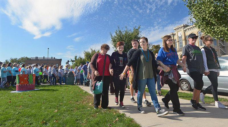 More than 100 walkers participated Sunday for the annual Out of the Darkness walk in Ottawa. The walk was sponsored by the American Foundation for Suicide Prevention to raise money and awareness to its cause. After the walk, a balloon release took place on the Jordan block.