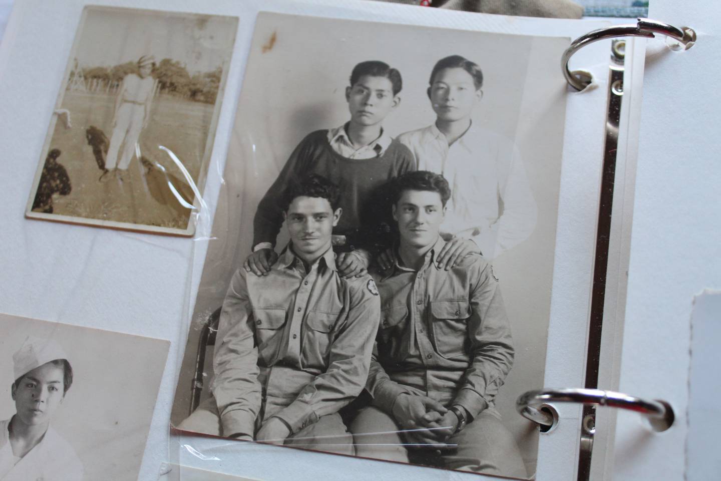 A photo of World War II veteran Peter Cirelli, bottom left, with kitchen colleagues including two captured Japanese pilots in Toyko, Japan.